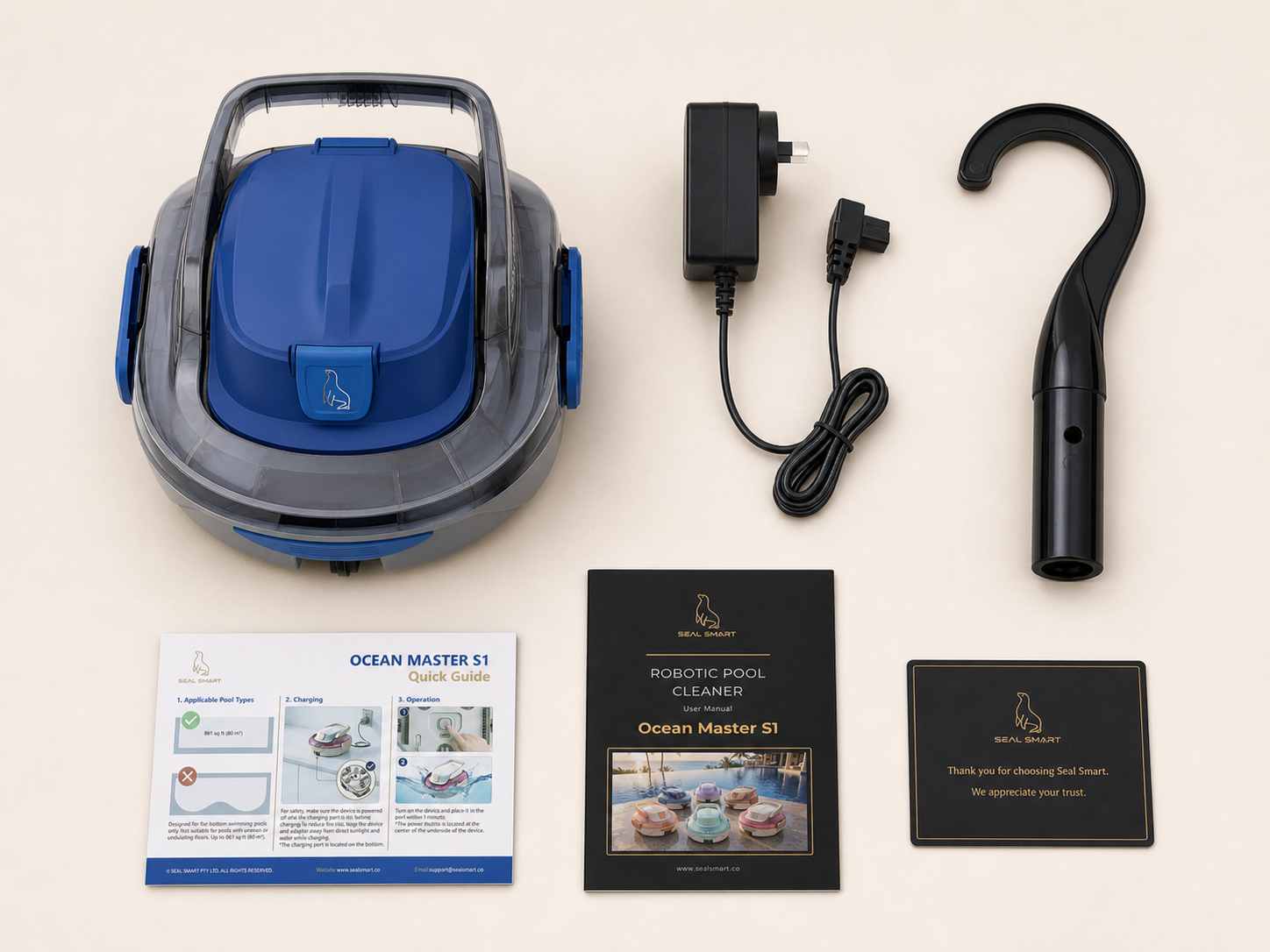Ocean Master S1 with charging adapter, retrieval hook, quick start guide, user manual and welcome card